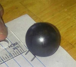 A magnetic ball and a staple