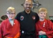 Matt, his brother and Taekwondo instructor